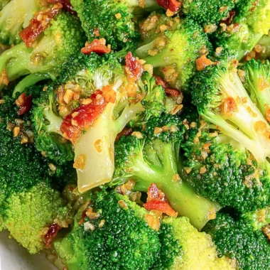 Asian Broccoli with Garlic Sauce and Crispy Bacon on a white plate