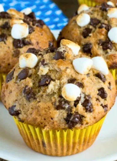 Freshly baked banana s'mores muffins with chocolate and marshmallows