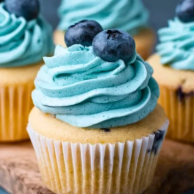 Delicious Blueberry Cream Cheese Frosting spread on a cupcake.