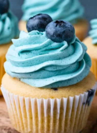 Delicious Blueberry Cream Cheese Frosting spread on a cupcake.