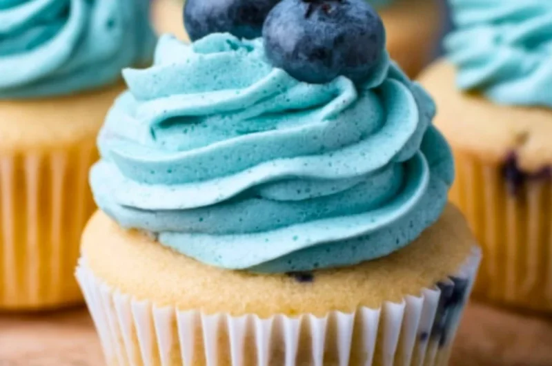 Delicious Blueberry Cream Cheese Frosting spread on a cupcake.