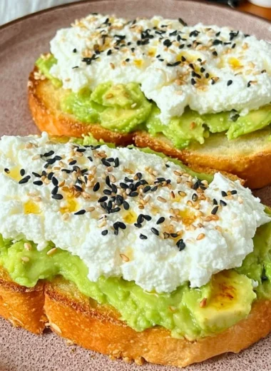Cottage cheese toast topped with fresh herbs and vegetables