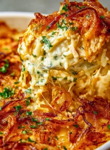 Creamy French onion chicken over rice served in a bowl