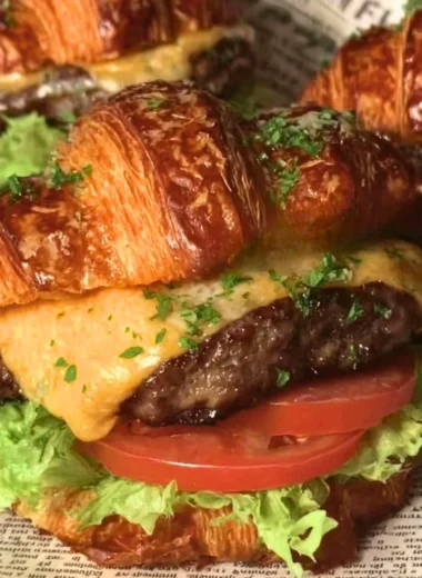 Delicious Croissant Smash Burgers served with fresh toppings