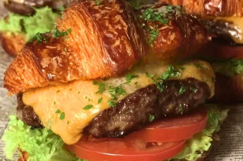 Delicious Croissant Smash Burgers served with fresh toppings