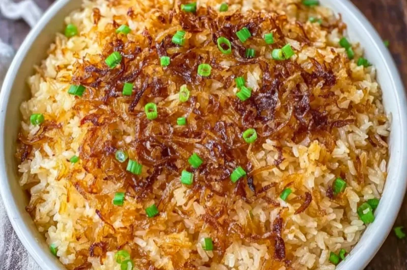 Delicious serving of French Onion Butter Rice garnished with herbs.