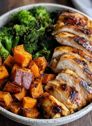 Grilled chicken served with sweet potato in a colorful bowl