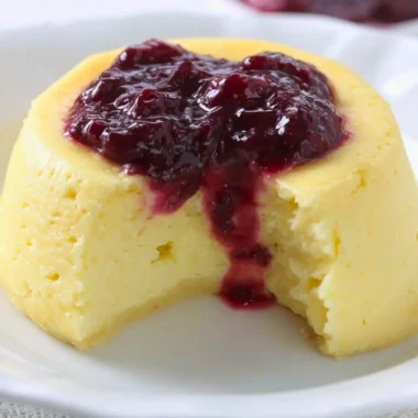 Delicious keto microwave cheesecake topped with fresh berries