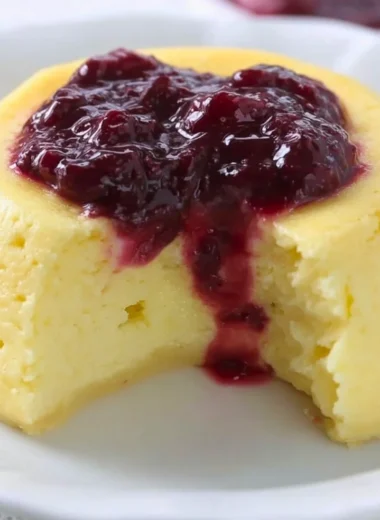 Delicious keto microwave cheesecake topped with fresh berries