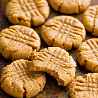 Soft and chewy keto peanut butter cookies on a wooden table