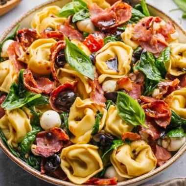 Delicious Tuscan Tortellini Salad with fresh ingredients and vibrant colors