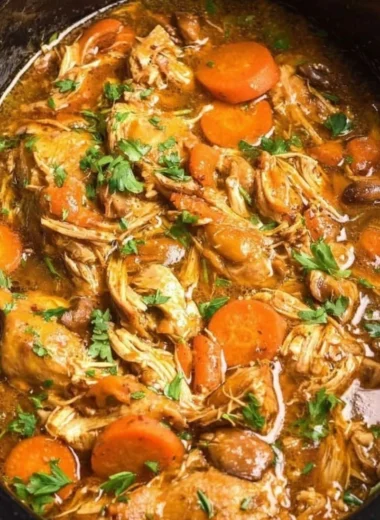 Delicious crockpot chicken thigh pot roast served with vegetables.