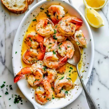 Delicious garlic butter shrimp scampi served with pasta and parsley garnish