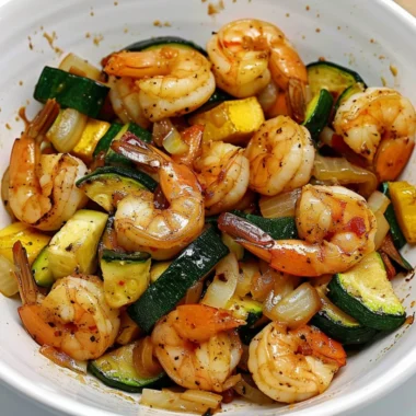 Delicious Hibachi Shrimp Rice Bowl garnished with vegetables and sauces.