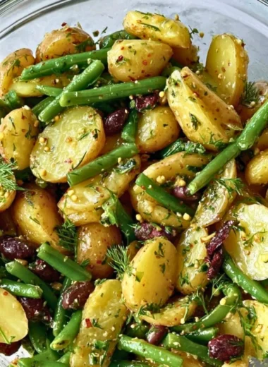 Potato Salad with Green Beans and Kalamata Olives served in a bowl