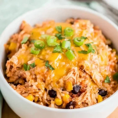Slow Cooker Chicken Burrito Bowl with rice, beans, and fresh toppings