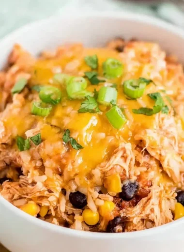 Slow Cooker Chicken Burrito Bowl with rice, beans, and fresh toppings