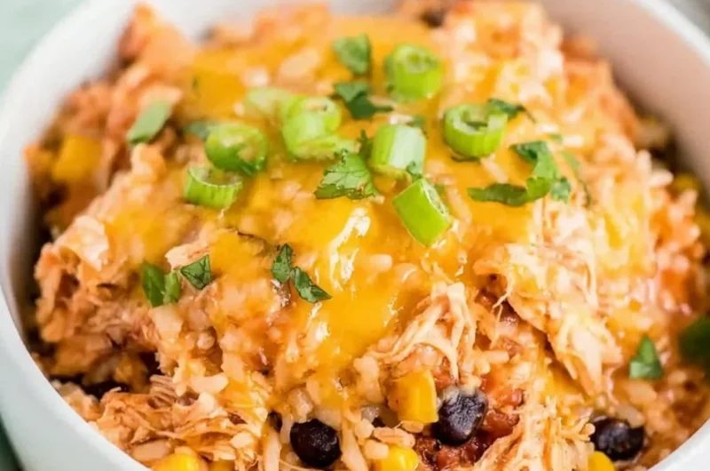 Slow Cooker Chicken Burrito Bowl with rice, beans, and fresh toppings