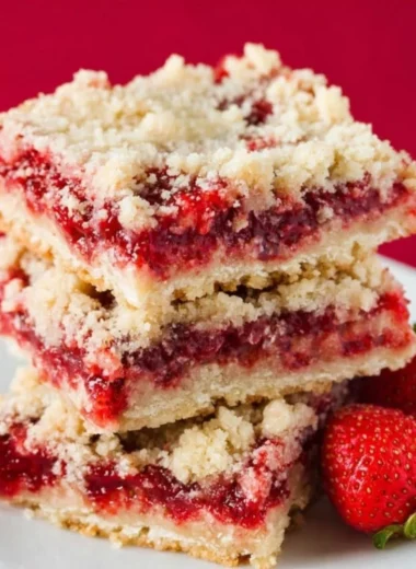 Delicious homemade strawberry crumb bars with a buttery crumb topping