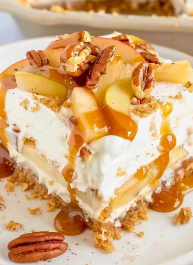 Delicious Apple Delight dessert with creamy layers and graham cracker crust