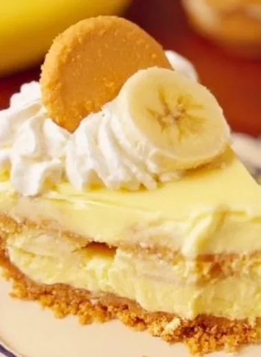 Slice of banana pudding cheesecake with banana slices on top