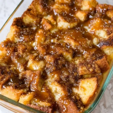 Delicious homemade bread pudding with caramel sauce and whipped cream
