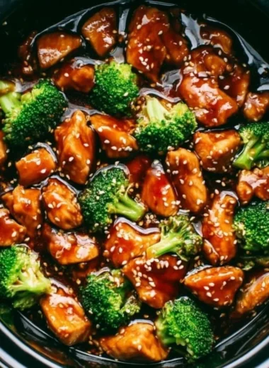 Delicious Dump and Go Crockpot Teriyaki Chicken dish served with rice and vegetables.