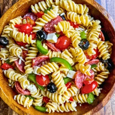 Colorful bowl of easy Italian Pasta Salad with vegetables and dressing