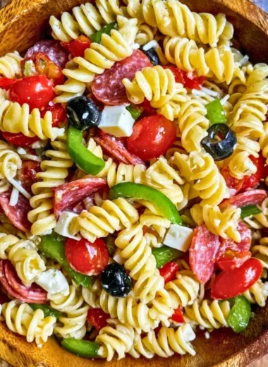 Colorful bowl of easy Italian Pasta Salad with vegetables and dressing