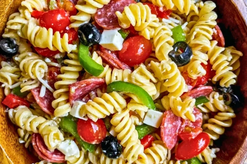 Colorful bowl of easy Italian Pasta Salad with vegetables and dressing
