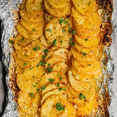 Delicious grilled garlic butter potatoes on a plate