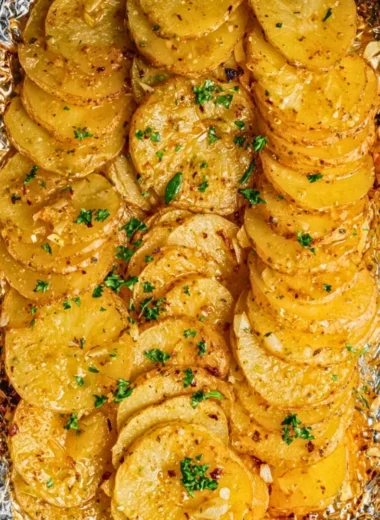 Delicious grilled garlic butter potatoes on a plate