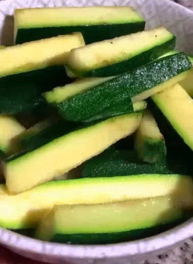 Crispy Keto Zucchini Fries served on a plate with dipping sauce