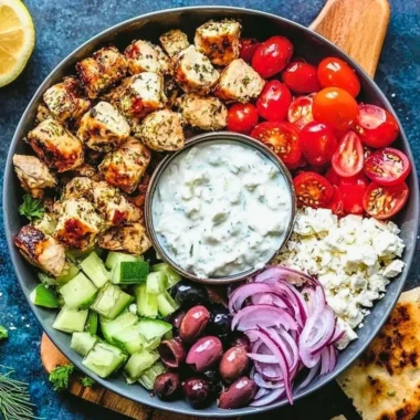 Low-Carb Keto Greek Chicken Bowl with fresh vegetables and seasoning