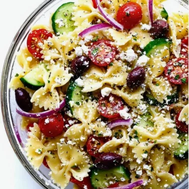 Colorful Mediterranean Pasta Salad with fresh vegetables and herbs