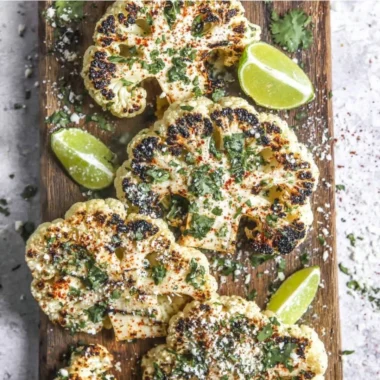 Plate of Mexican Street Cauliflower (Elote) topped with spices and cheese
