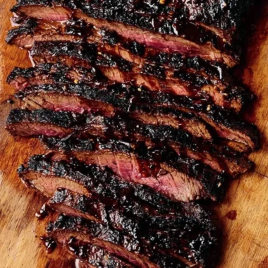 Balsamic flank steak served with grilled zucchini and whipped feta cheese.