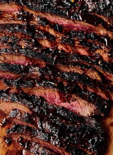 Balsamic flank steak served with grilled zucchini and whipped feta cheese.