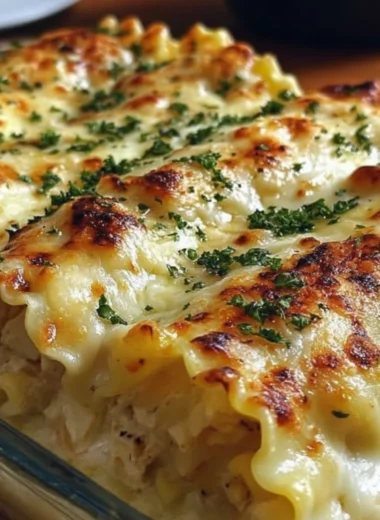 Creamy Chicken Alfredo Lasagna Rolls on a plate with fresh herbs
