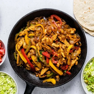 Delicious homemade Chicken Fajitas with colorful bell peppers and seasonings