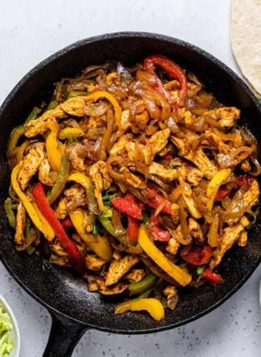 Delicious homemade Chicken Fajitas with colorful bell peppers and seasonings