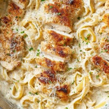 Delicious Chicken Fettuccine Alfredo served with parsley garnish