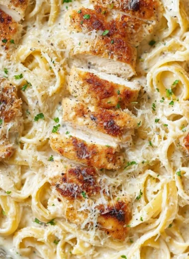 Delicious Chicken Fettuccine Alfredo served with parsley garnish