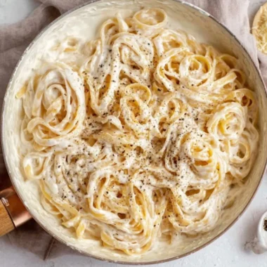 Delicious Cottage Cheese Alfredo sauce over pasta topped with herbs.