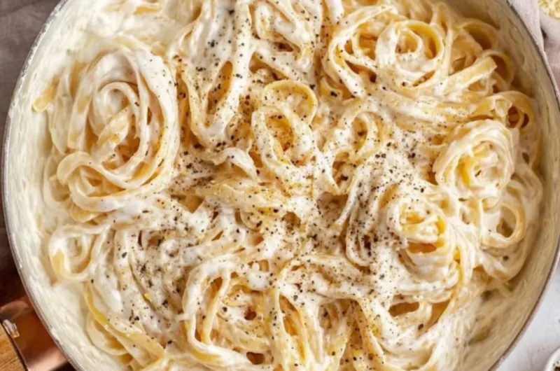 Delicious Cottage Cheese Alfredo sauce over pasta topped with herbs.