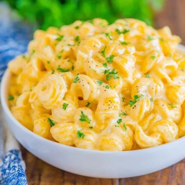 Creamy mac and cheese recipe with cheese sauce and pasta in a baking dish