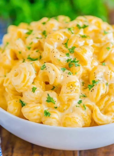 Creamy mac and cheese recipe with cheese sauce and pasta in a baking dish