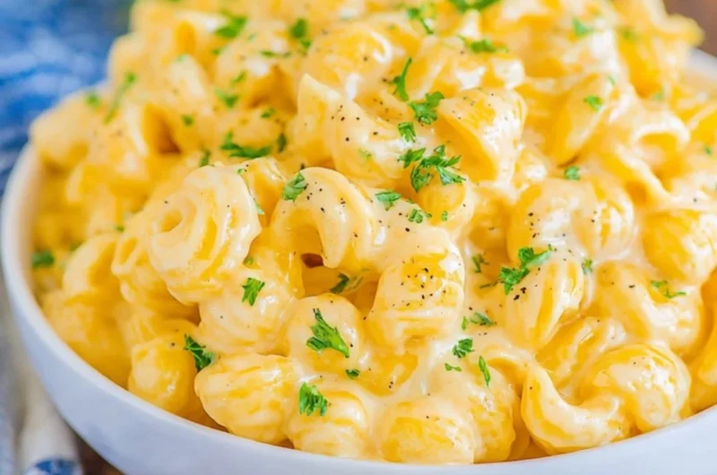 Creamy mac and cheese recipe with cheese sauce and pasta in a baking dish