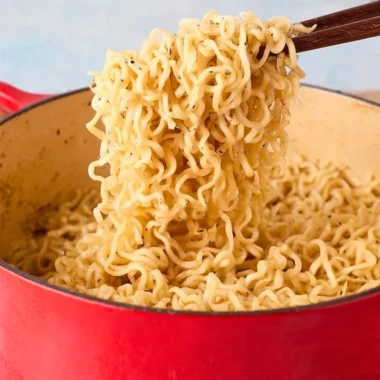 Delicious bowl of Garlic Butter Ramen Noodles garnished with herbs