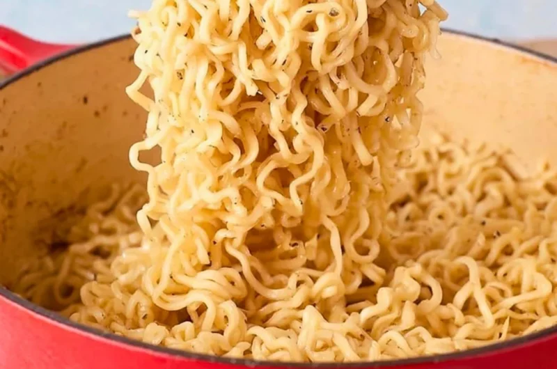 Delicious bowl of Garlic Butter Ramen Noodles garnished with herbs